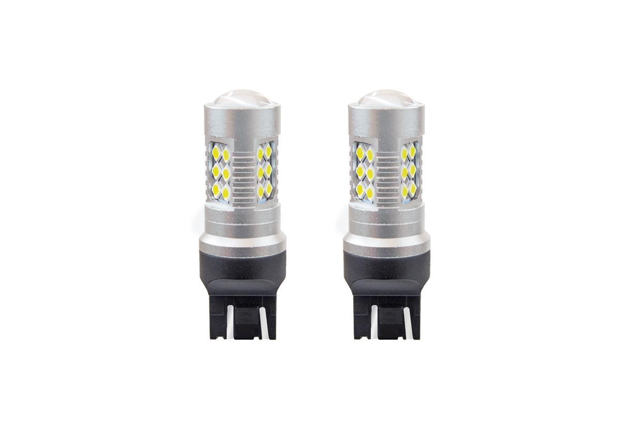 Amio - Λαμπτήρες LED τύπου W21/5W (T20 / 7443) για 12V & 24V ισχύος 6.2W με ψυχρό λευκό φως 5600K και 24 SMD 3030 CANBUS για αυξημένη ορατότητα πίσω φωτισμού - 1 Σετ (02126/AM)